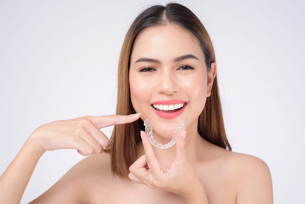 how does Invisalign move teeth